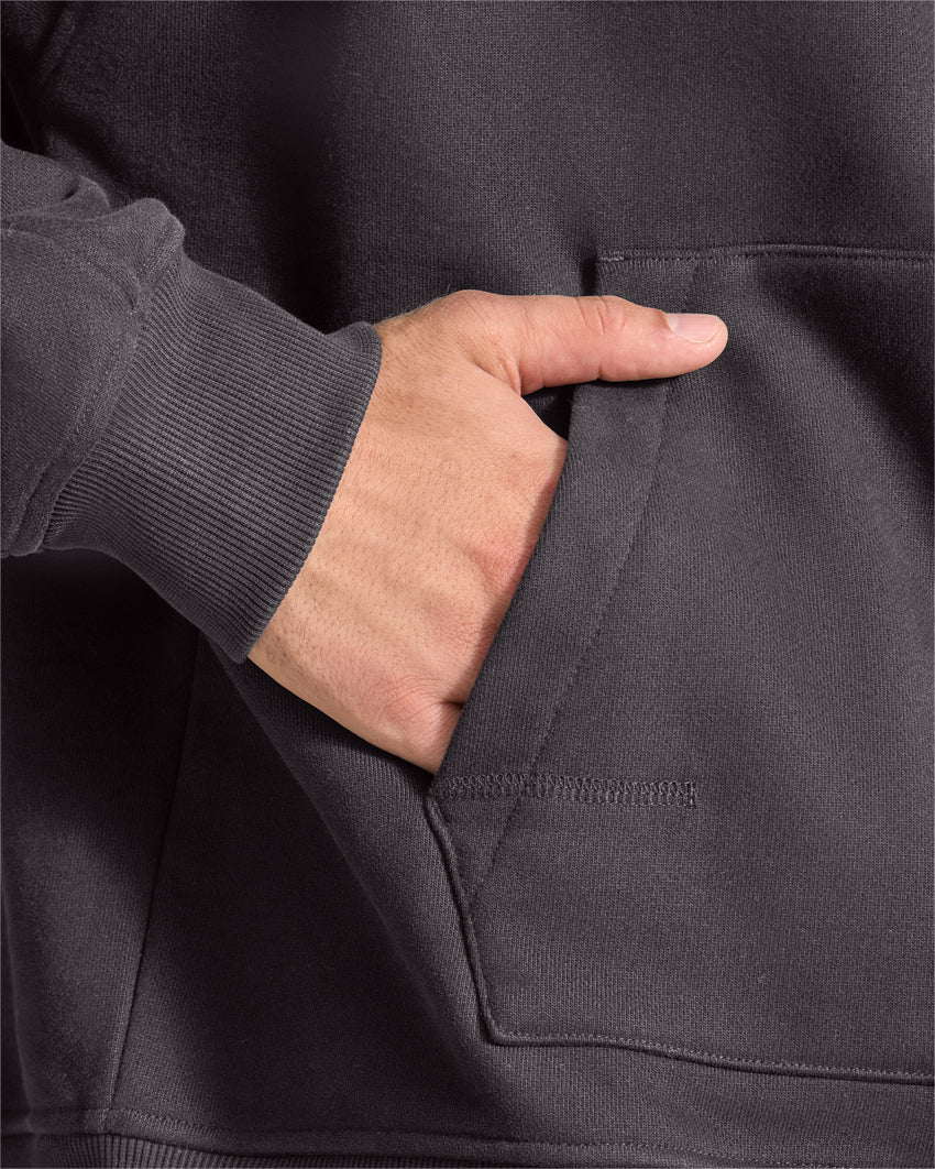 Dark-Charcoal | Close-up of the Heavyweight Fleece Hoodie kangaroo pocket with hand inside
