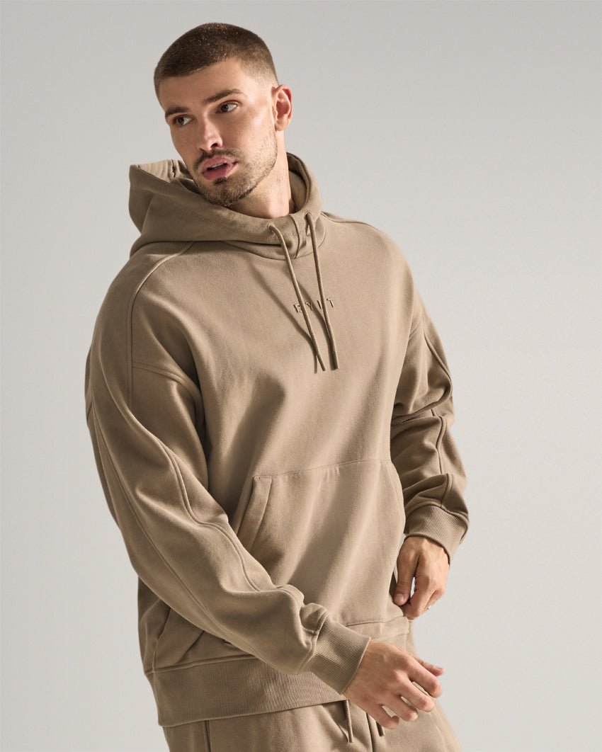 Taupe | Three-quarter view of the Heavyweight Fleece Hoodie showing relaxed fit and kangaroo pocket